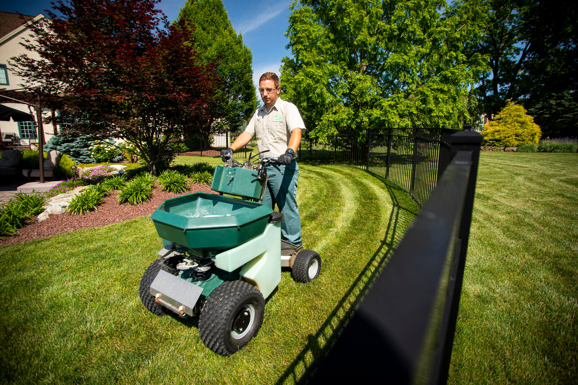 lawn tech on residential lawn